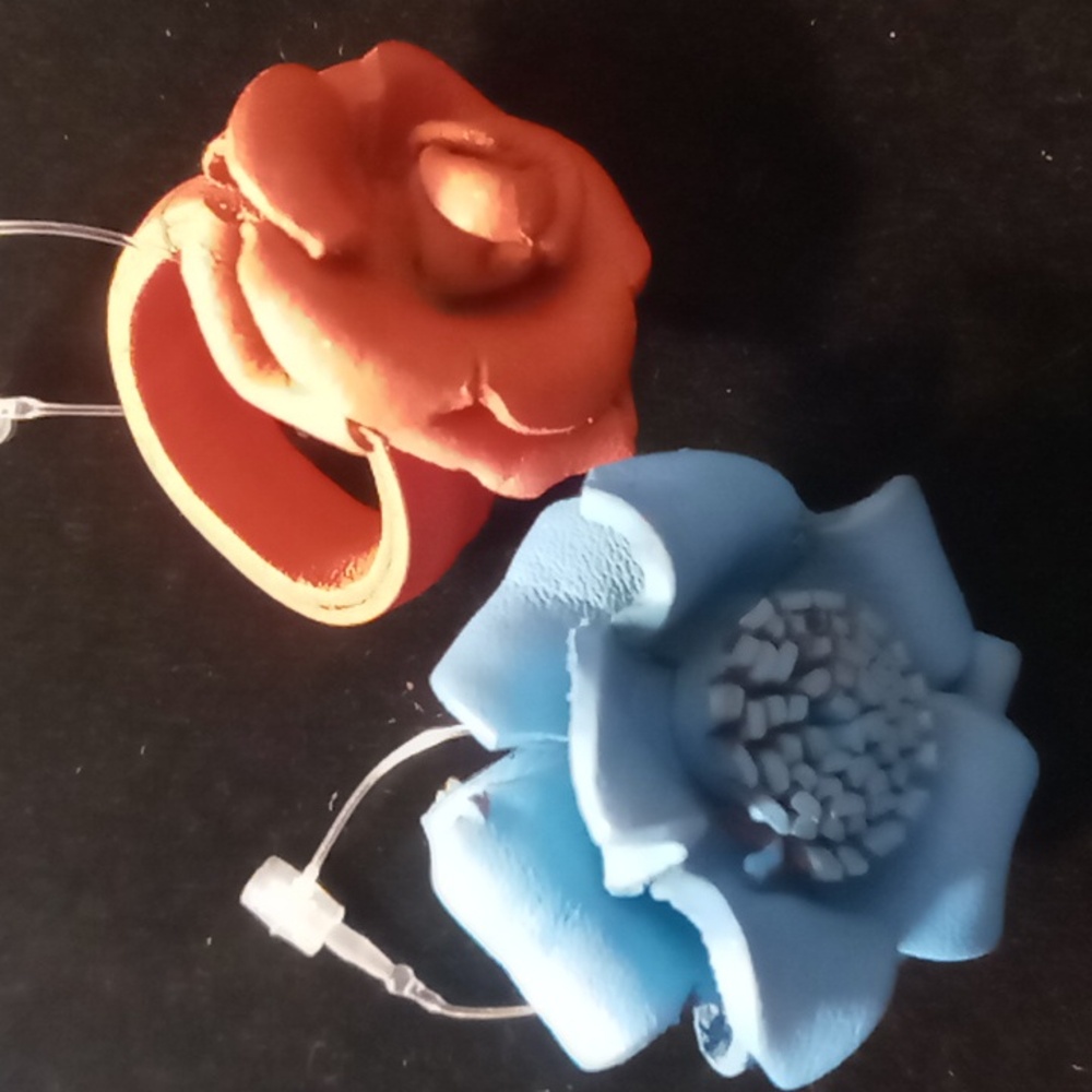Two's company leather flower rings 2 blue & burnt orange adjustable up size 9